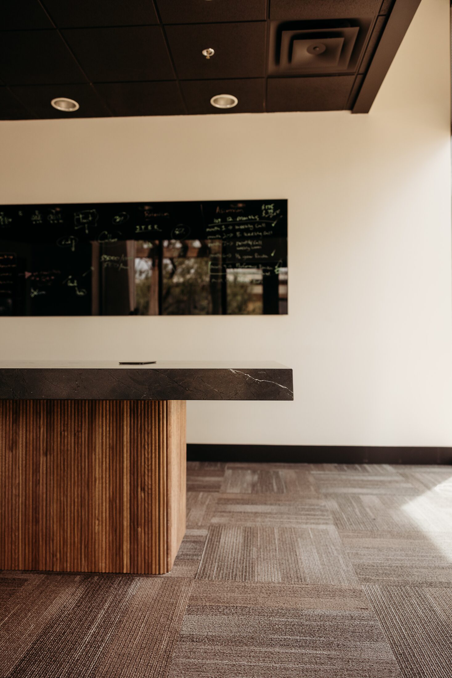 Fluted white oak base panel on a custom executive conference table